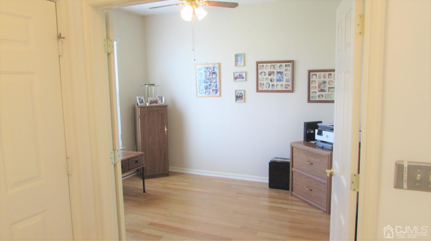91 Wordsworth Road Brick, NJ 08724 - Photo 6 of 41 a view of a kitchen with fridge and workspace