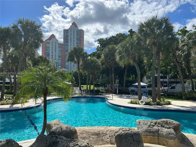a view of a swimming pool and lounge chair