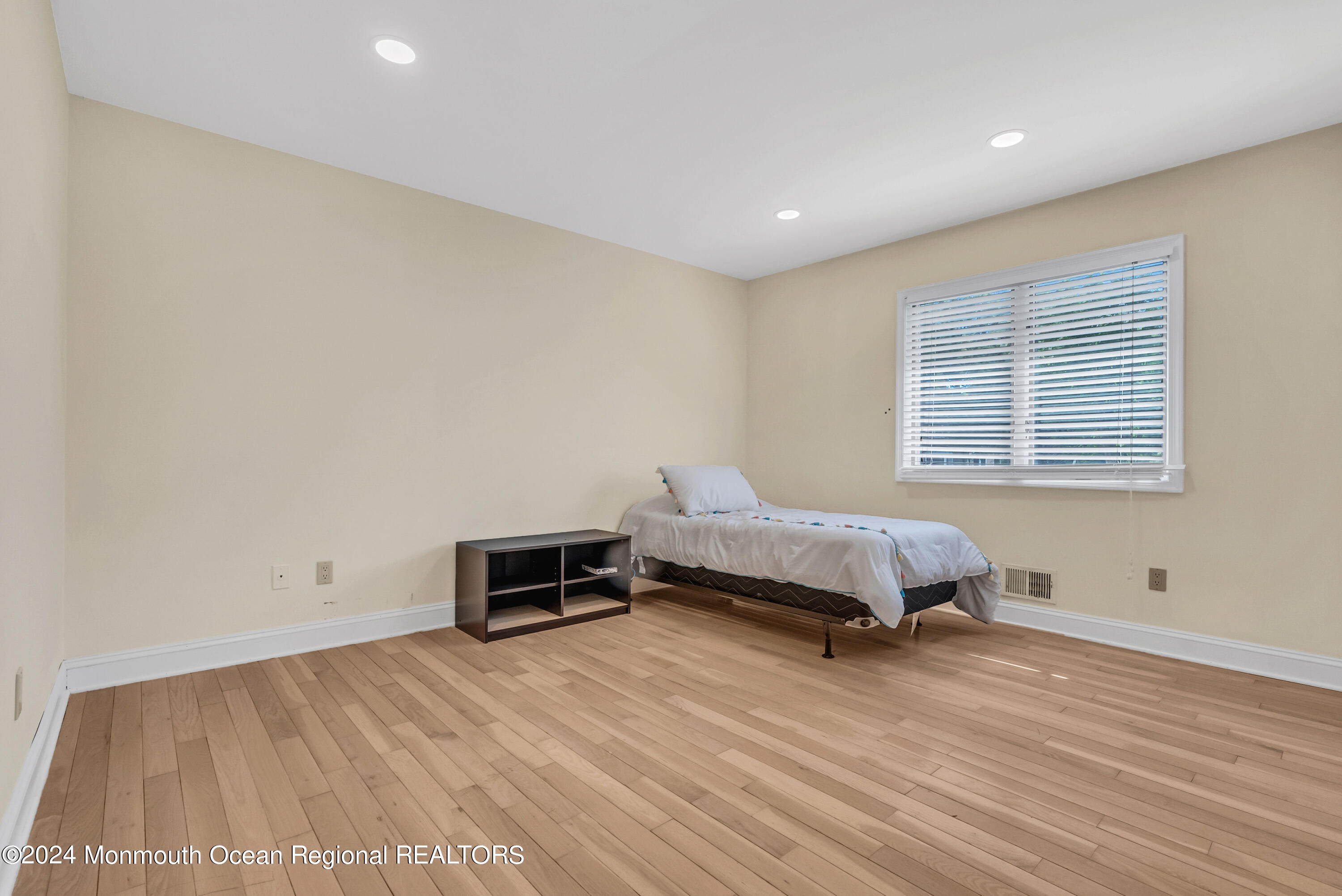 7 Decamp Court West Long Branch, NJ 07764 - Photo 13 of 32 a spacious bedroom with a bed and a window