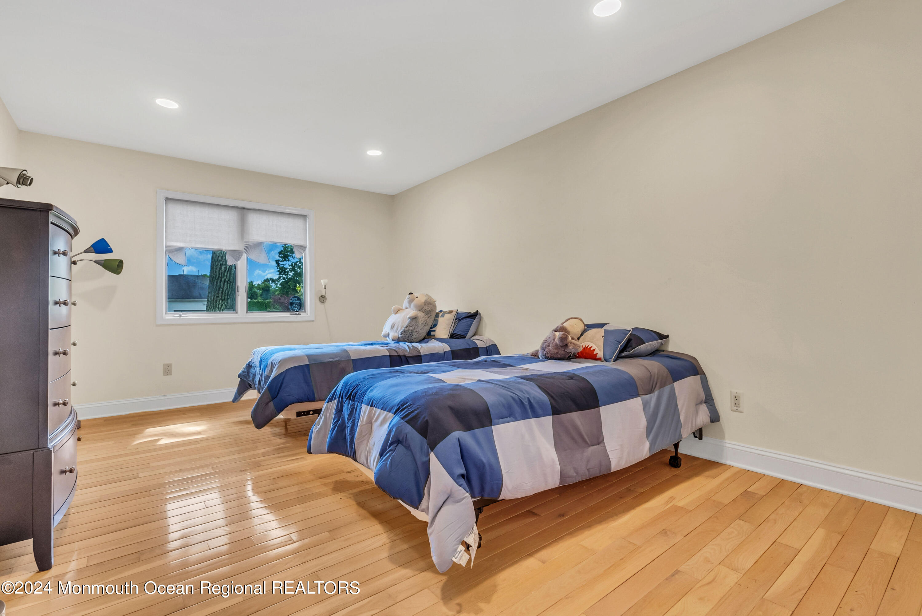 7 Decamp Court West Long Branch, NJ 07764 - Photo 17 of 32 a spacious bedroom with a bed and wooden floor