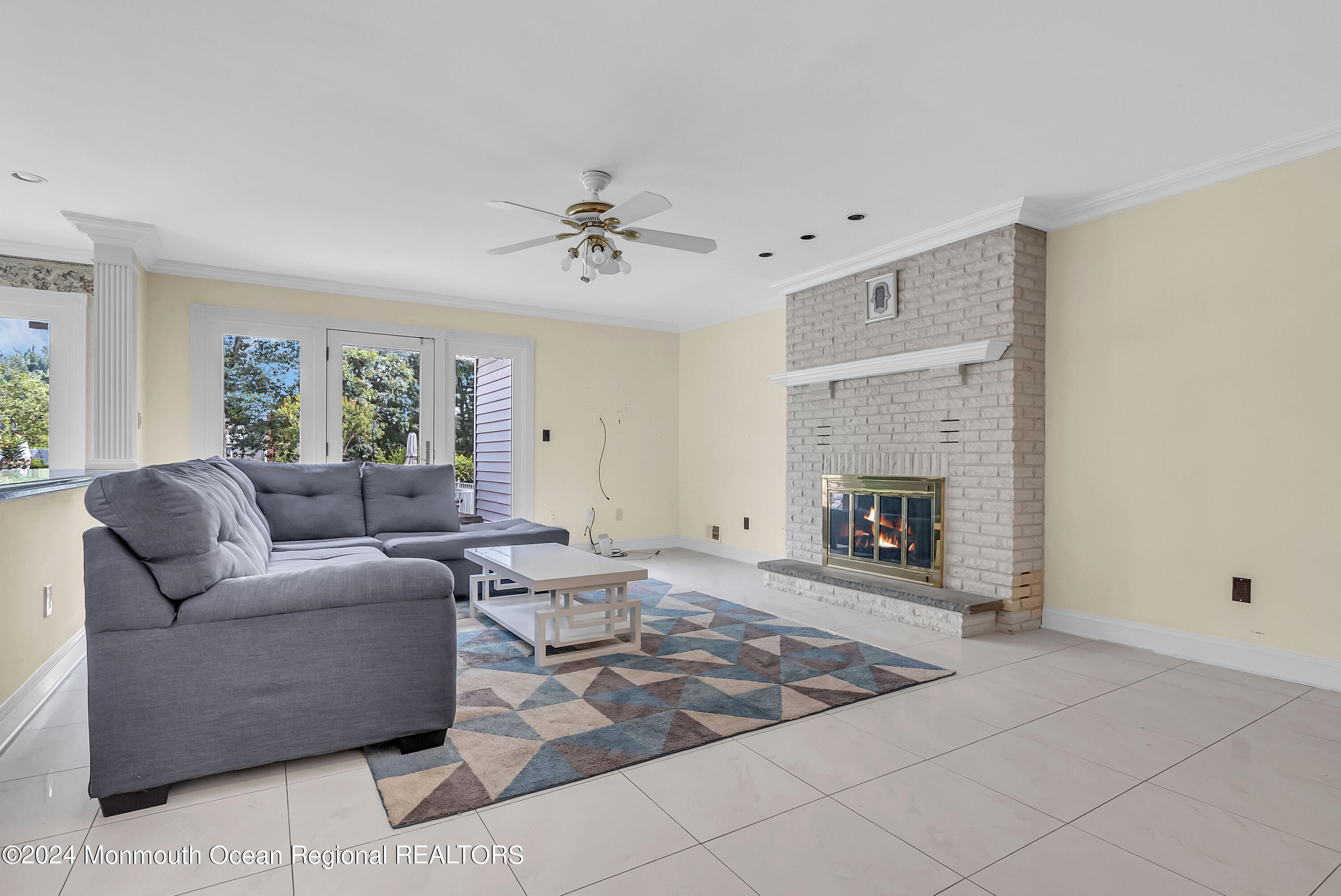 7 Decamp Court West Long Branch, NJ 07764 - Photo 19 of 32 a living room with furniture and a fireplace