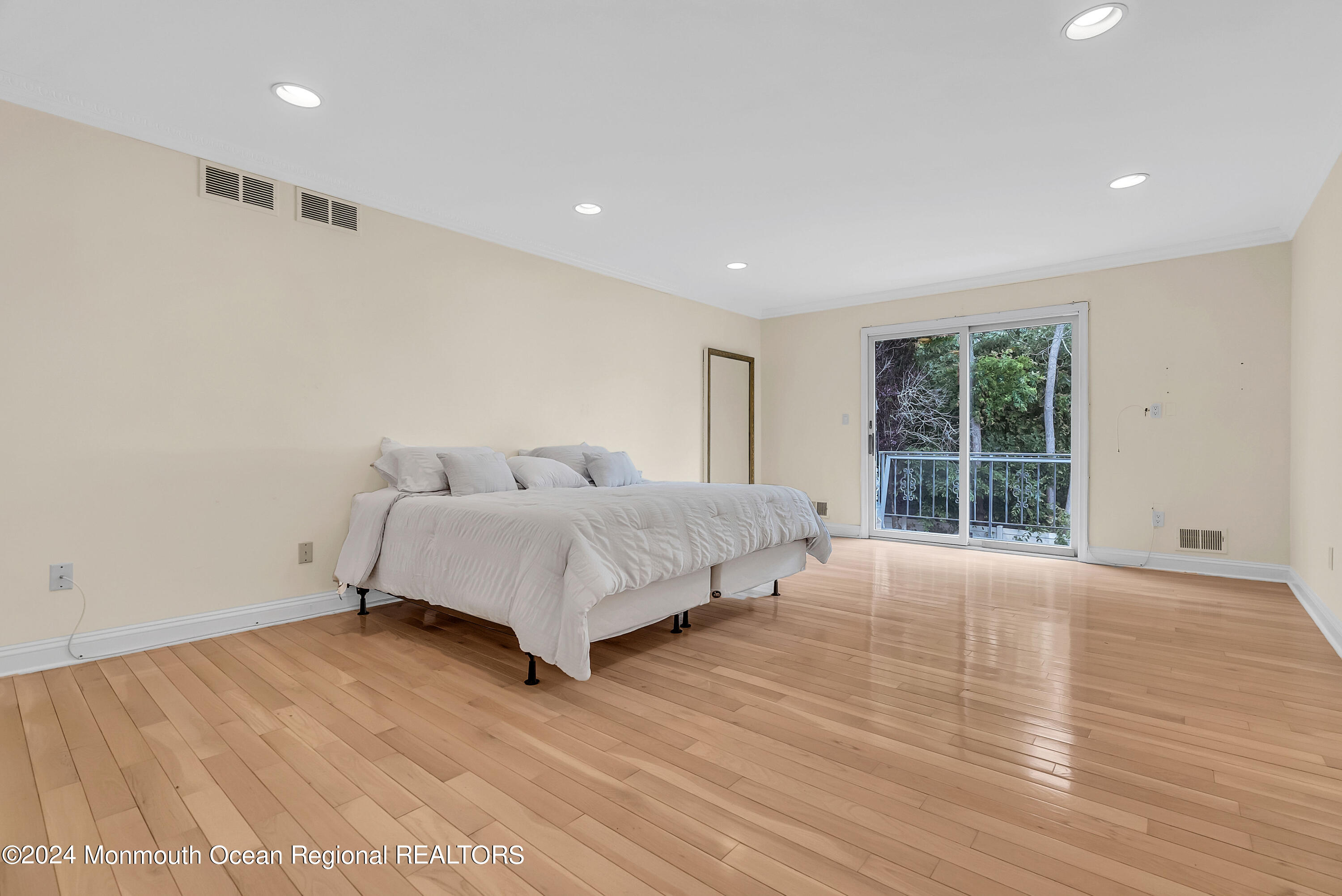 7 Decamp Court West Long Branch, NJ 07764 - Photo 24 of 32 a bedroom with a large bed and a large window