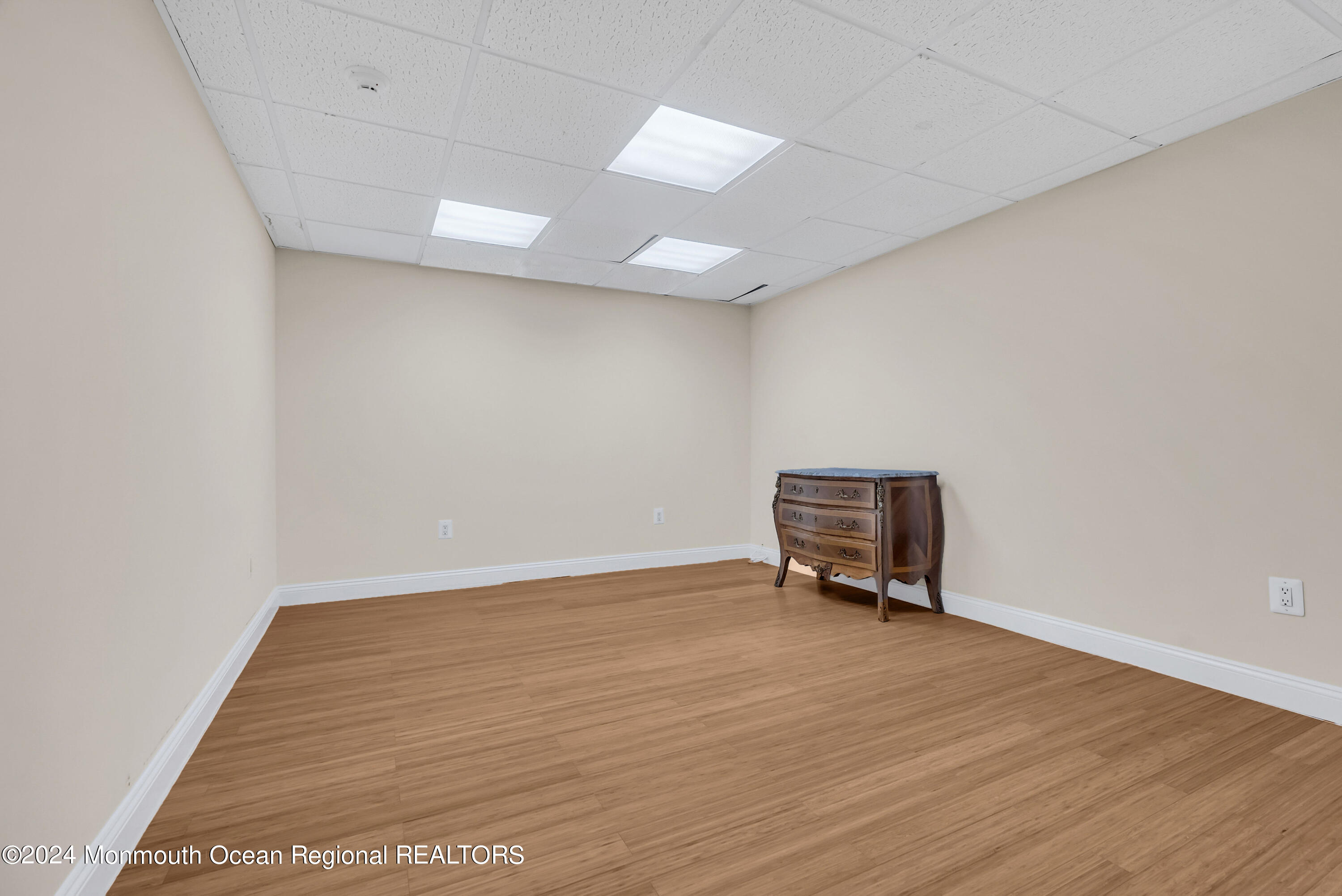 7 Decamp Court West Long Branch, NJ 07764 - Photo 29 of 32 an empty room with wooden floor