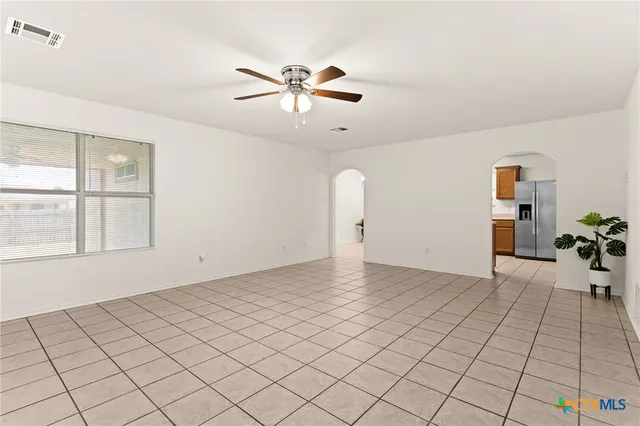 a view of an empty room and window