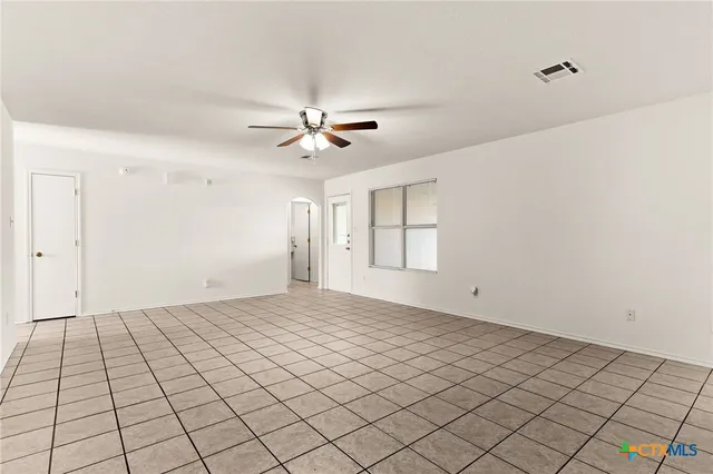 a view of an empty room and window