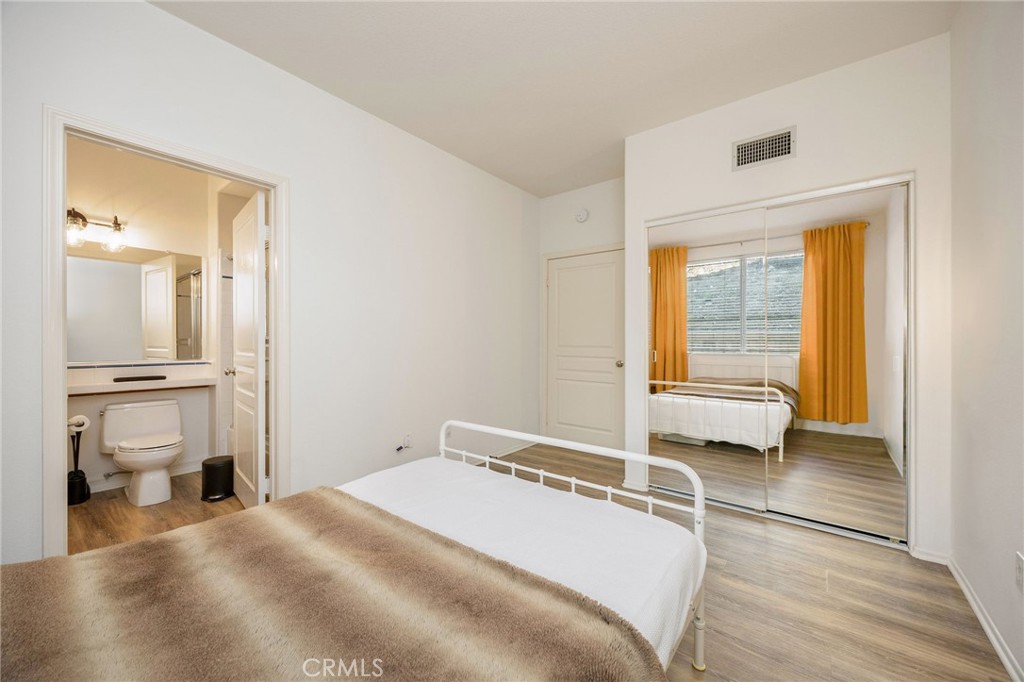 7211 Rock Ridge Terrace West Hills, CA 91307 - Photo 16 of 38 a room with a bed and a view of living room