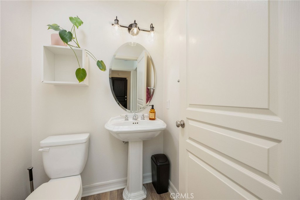 7211 Rock Ridge Terrace West Hills, CA 91307 - Photo 18 of 38 a bathroom with a toilet sink and mirror