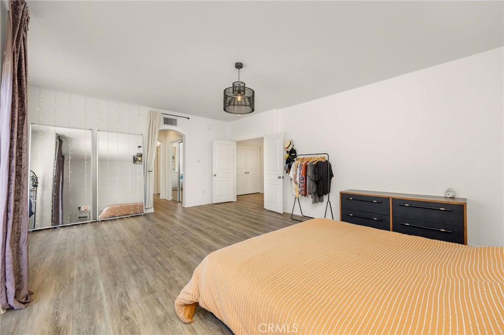 7211 Rock Ridge Terrace West Hills, CA 91307 - Photo 20 of 38 a bedroom with a bed and wooden floor