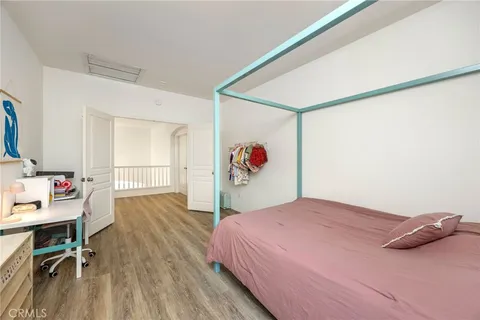 a bedroom with a bed and a table in it