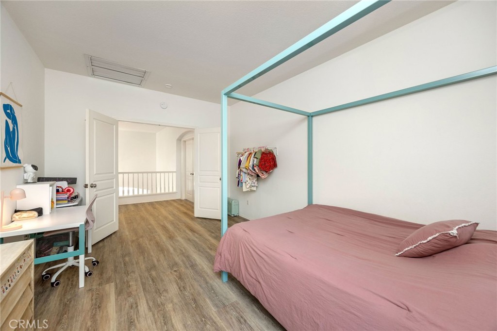 7211 Rock Ridge Terrace West Hills, CA 91307 - Photo 24 of 38 a bedroom with a bed and a table in it