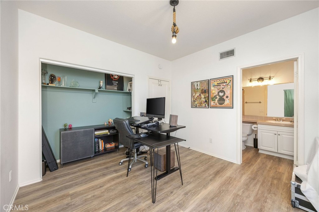 7211 Rock Ridge Terrace West Hills, CA 91307 - Photo 29 of 38 a workspace with wooden floor and a window