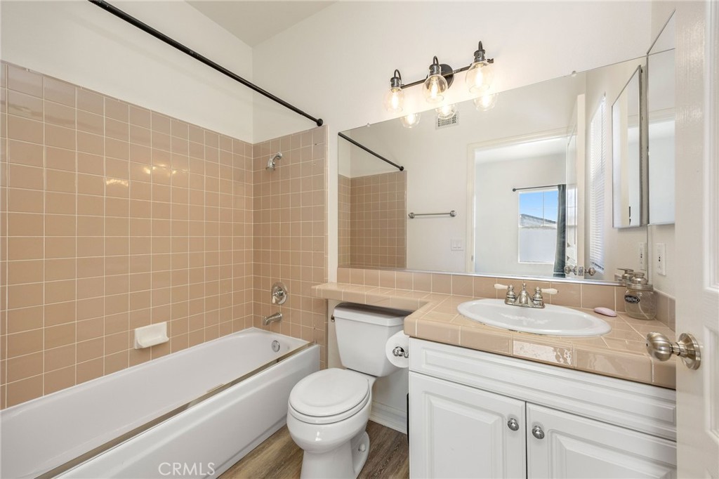 7211 Rock Ridge Terrace West Hills, CA 91307 - Photo 31 of 38 a bathroom with a sink a toilet and shower