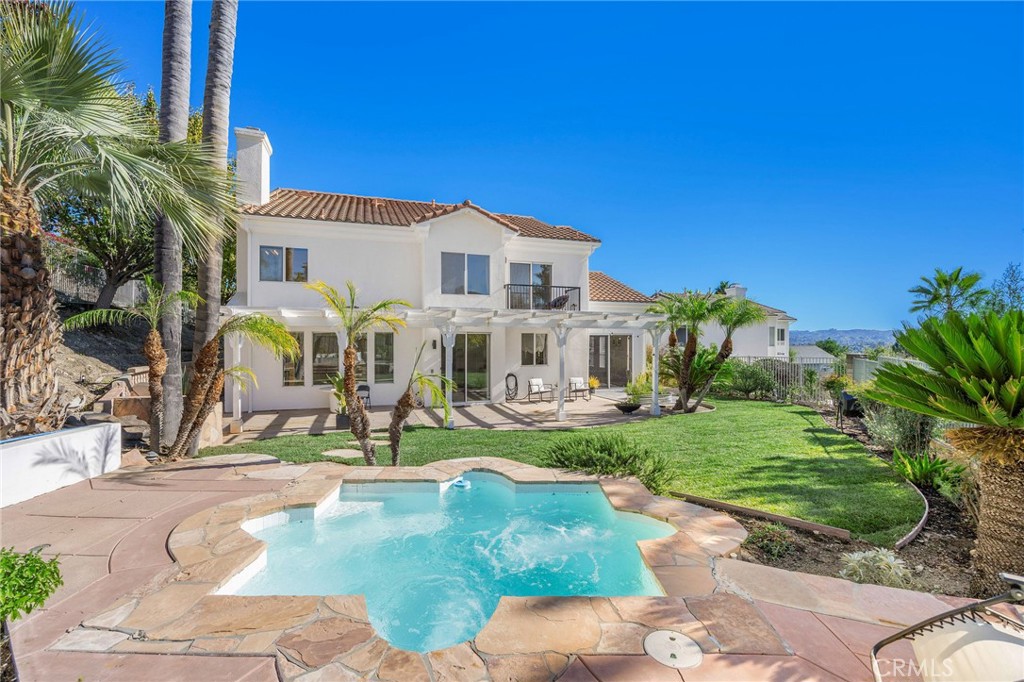 7211 Rock Ridge Terrace West Hills, CA 91307 - Photo 35 of 38 a view of a house with backyard porch and sitting area