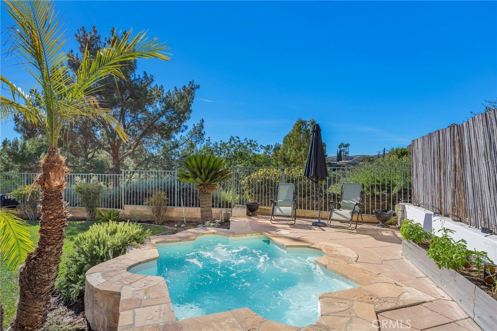 7211 Rock Ridge Terrace West Hills, CA 91307 - Photo 36 of 38 a view of a garden with a fountain