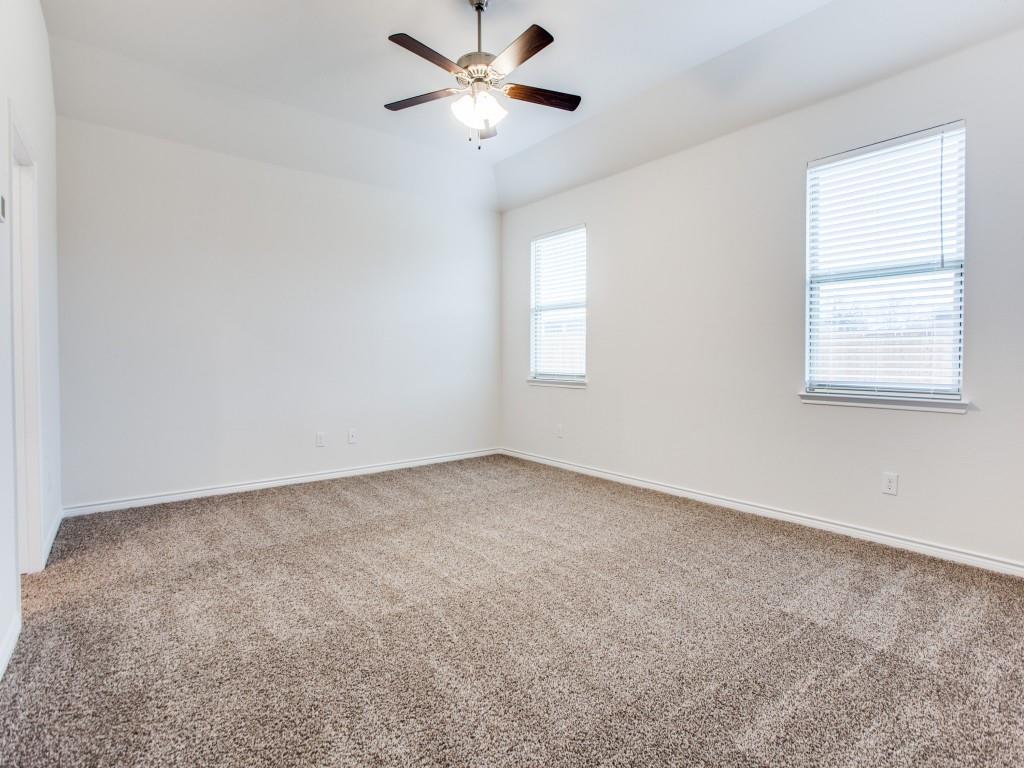 123 Lakeview Circle Pilot Point, TX 76258 - Photo 22 of 39 an empty room with a window and a fan