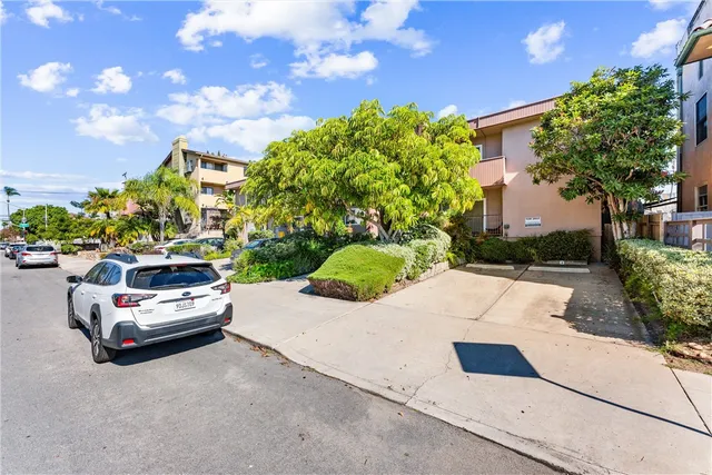 a view of street with parked cars