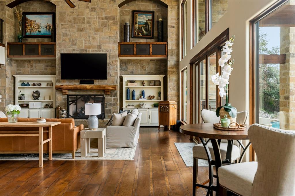 9930 Boat Club Road Fort Worth, TX 76179 - Photo 11 of 40 Main residence great room features beamed sky-high ceilings and floor to ceiling windows providing stunning views of the water.