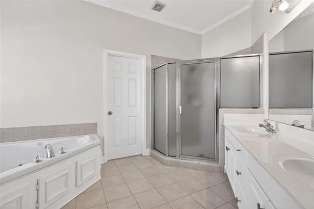 a bathroom with a sink double vanity and a mirror