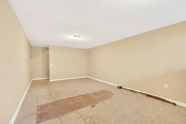 a living room with lots of furniture and a flat screen tv
