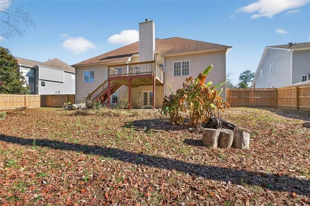a backyard of a house with lots of green space