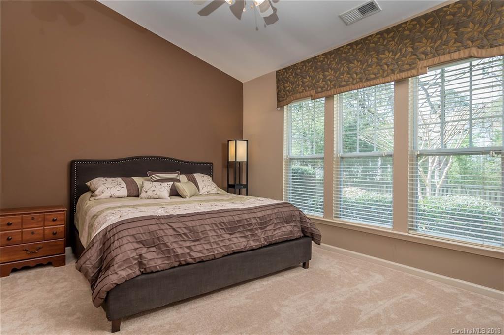 134 Whitley Mills Road, Unit 78 Fort Mill, SC 29708 - Photo 11 of 25 a large bed sitting in a bedroom next to a window