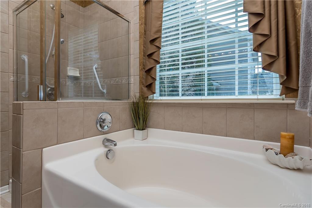 134 Whitley Mills Road, Unit 78 Fort Mill, SC 29708 - Photo 14 of 25 a white bath tub sitting next to a white sink
