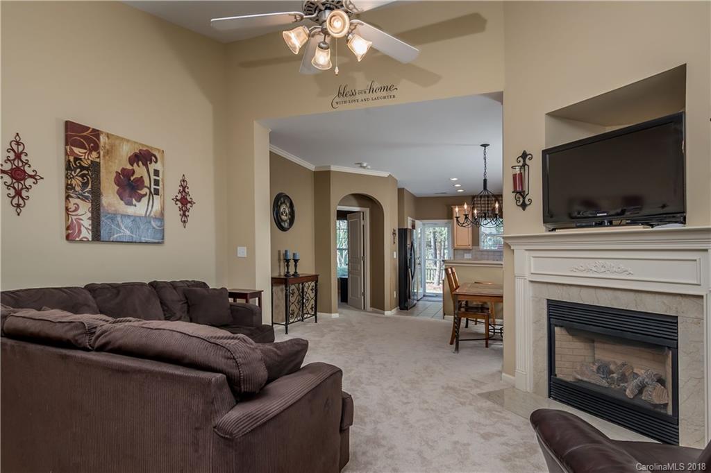 134 Whitley Mills Road, Unit 78 Fort Mill, SC 29708 - Photo 3 of 25 a living room with furniture and a fireplace