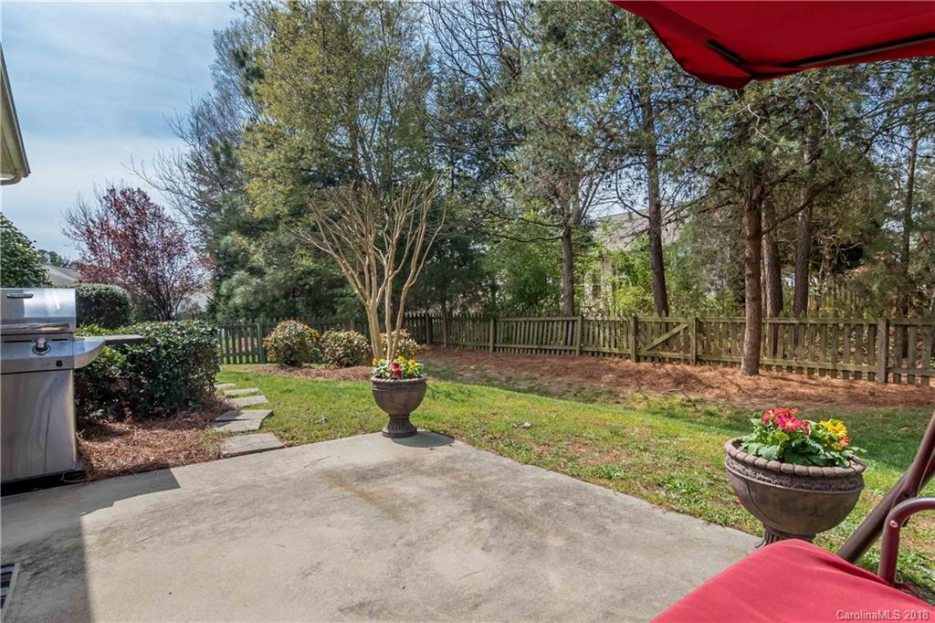 134 Whitley Mills Road, Unit 78 Fort Mill, SC 29708 - Photo 21 of 25 a view of a backyard with sitting area and garden