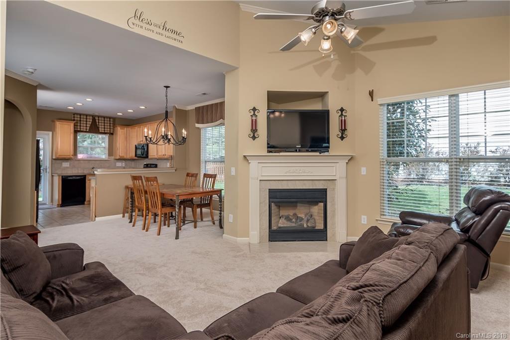 134 Whitley Mills Road, Unit 78 Fort Mill, SC 29708 - Photo 4 of 25 a living room with furniture and a fireplace
