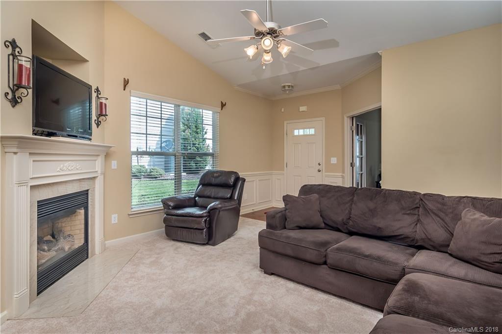 134 Whitley Mills Road, Unit 78 Fort Mill, SC 29708 - Photo 5 of 25 a living room with furniture fireplace and flat screen tv