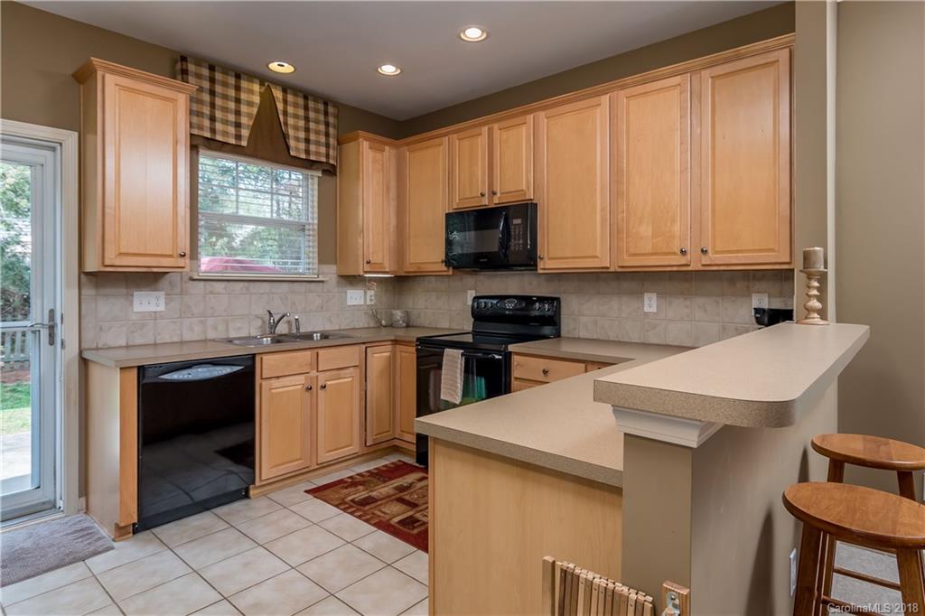 134 Whitley Mills Road, Unit 78 Fort Mill, SC 29708 - Photo 8 of 25 a kitchen with a sink stove and microwave