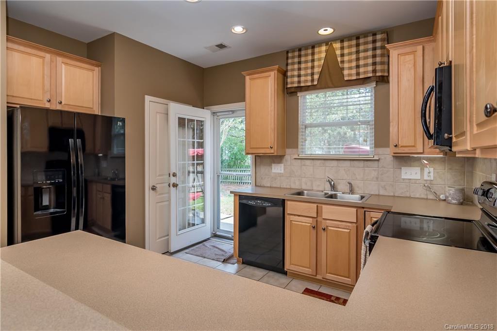 134 Whitley Mills Road, Unit 78 Fort Mill, SC 29708 - Photo 10 of 25 a kitchen with stainless steel appliances a refrigerator sink and cabinets