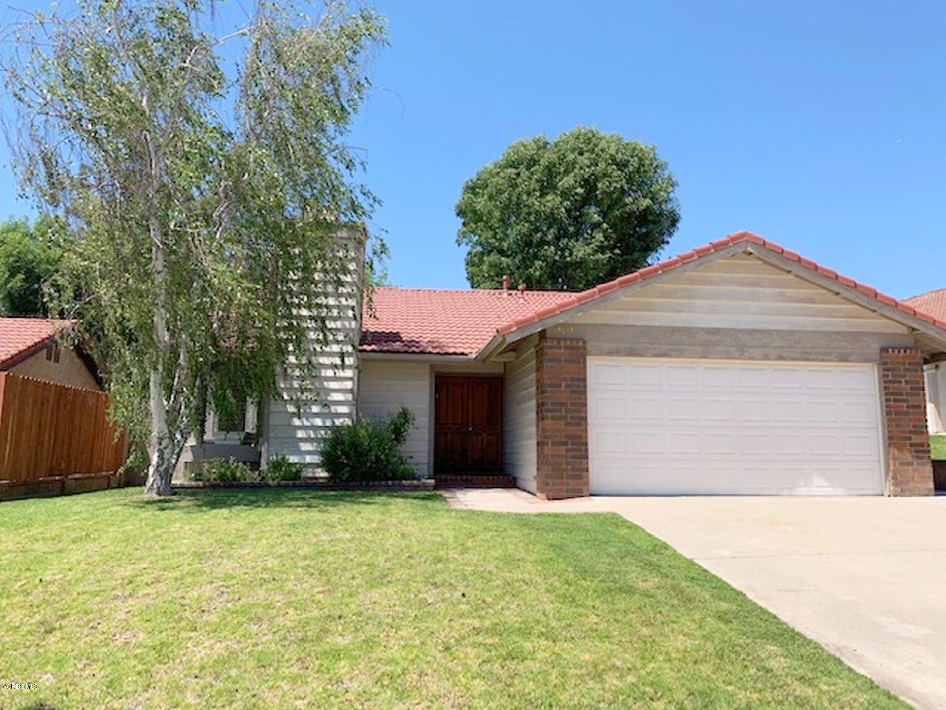 13653 Bear Valley Road Moorpark, CA 93021 - Photo 1 of 18 a front view of a house with a garden