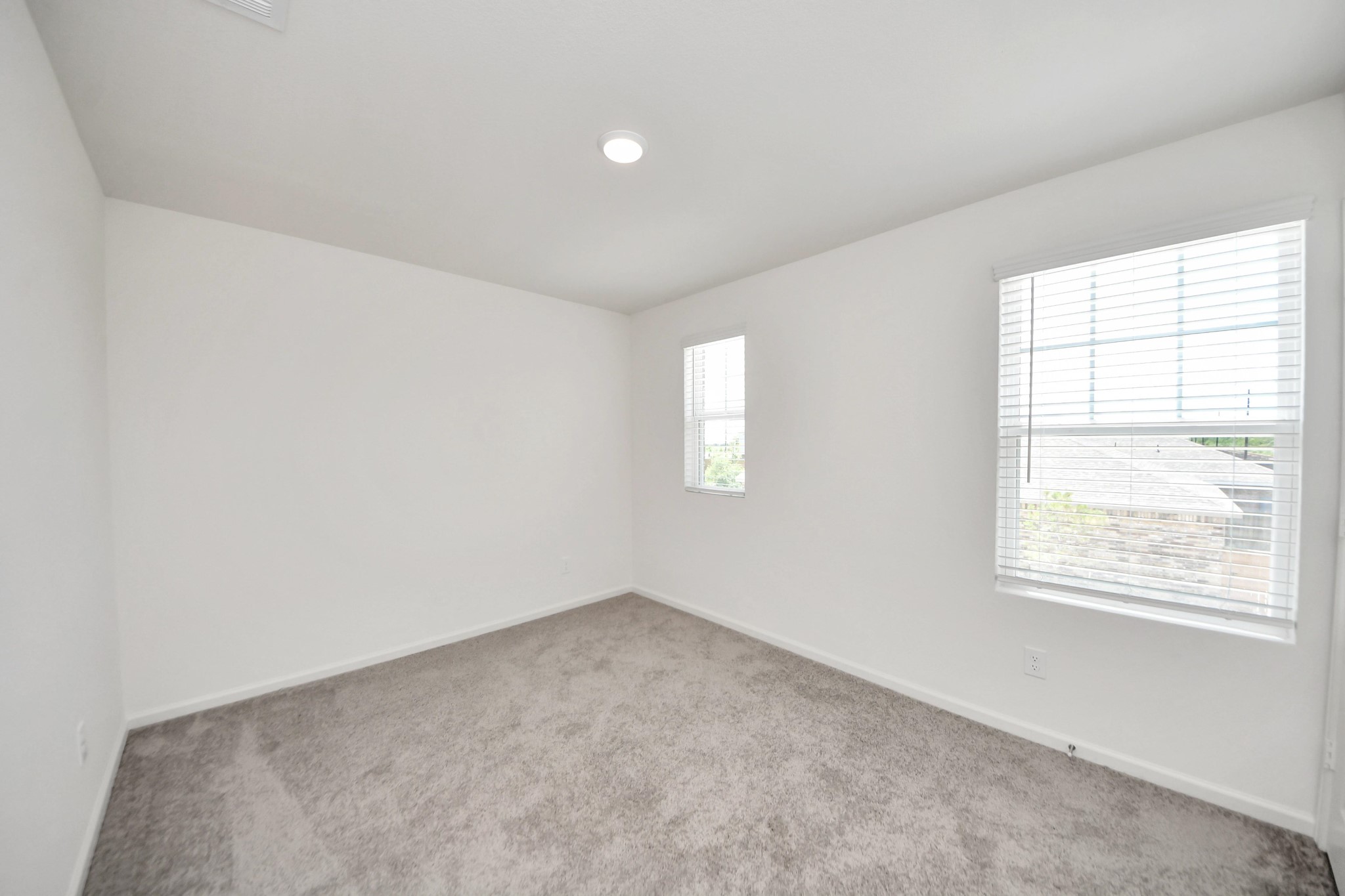 10303 Rose Mar Drive, Unit B Rosharon, TX 77583 - Photo 32 of 49 an empty room with windows