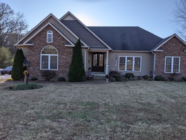 a front view of a house with garden