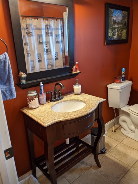 7215 Chestnut Ridge Road Winchester, TN 37398 - Photo 26 of 28 a bathroom with a sink a toilet and mirror