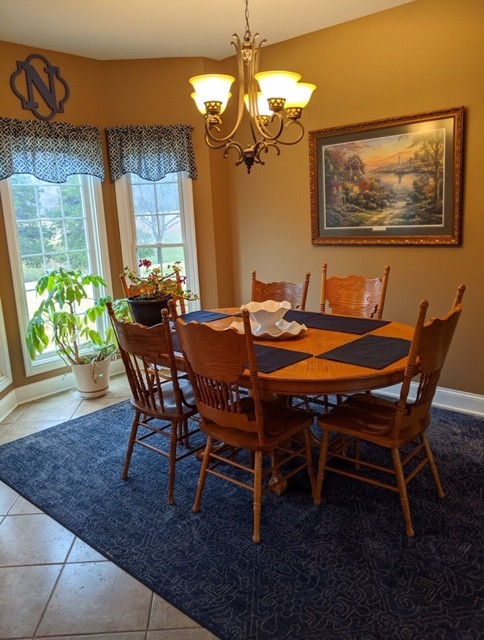 7215 Chestnut Ridge Road Winchester, TN 37398 - Photo 10 of 28 a dining room with furniture a rug and a chandelier