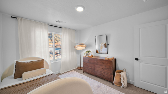324 North Rhyolite Drive, Unit 87 Hurricane, UT 84737 - Photo 17 of 33 Bedroom featuring light colored carpet and baseboards