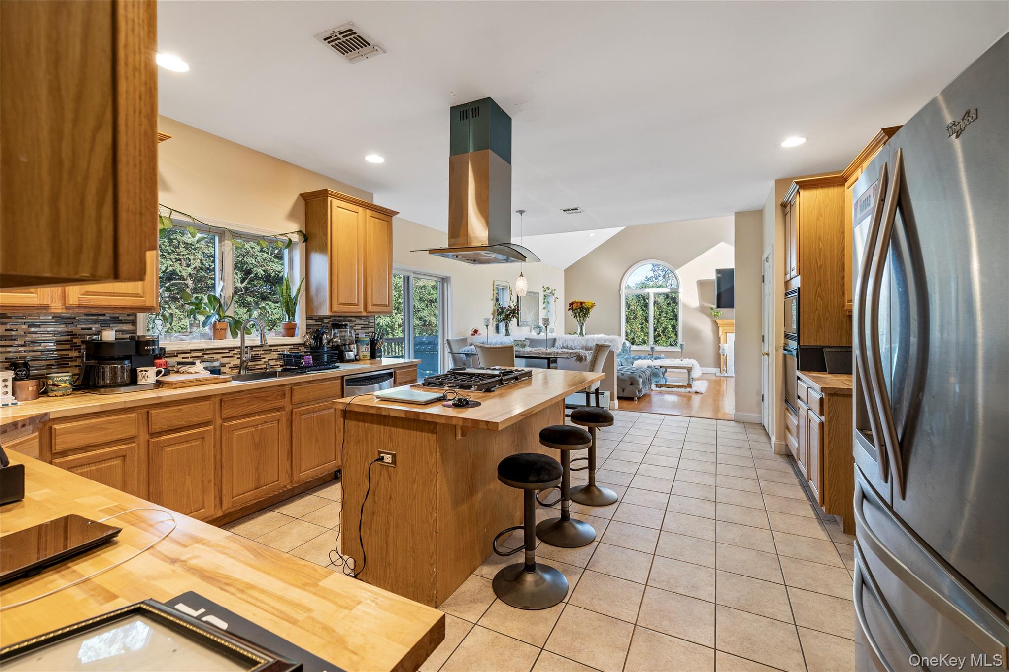 35 Pierce Road Stony Point, NY 10980 - Photo 45 of 45 Kitchen featuring wooden counters, stainless steel appliances, open floor plan, a kitchen island, and light tile patterned floors