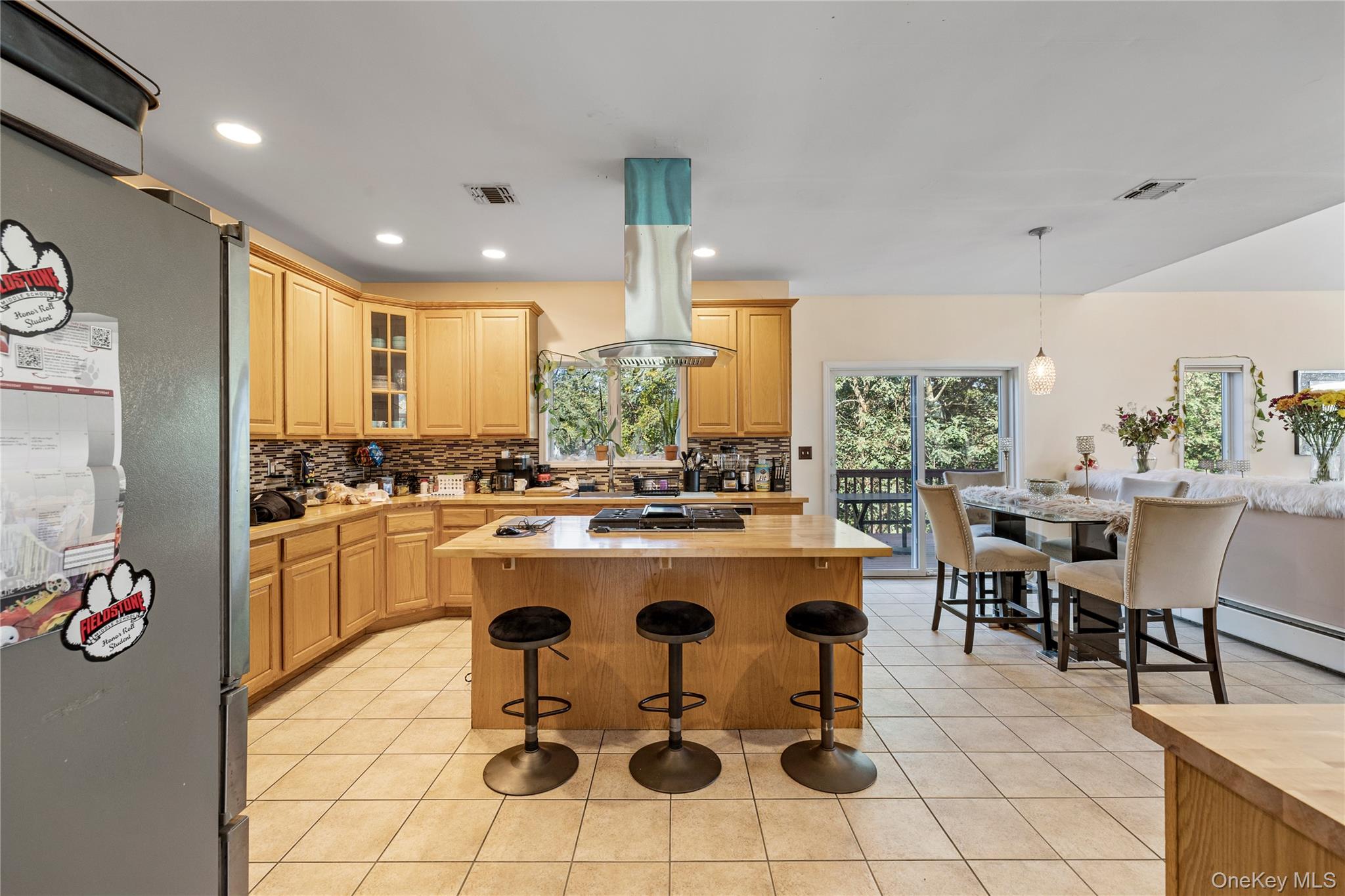 35 Pierce Road Stony Point, NY 10980 - Photo 19 of 45 Kitchen featuring a kitchen breakfast bar, stainless steel appliances, a kitchen island, light tile patterned flooring, and recessed lighting