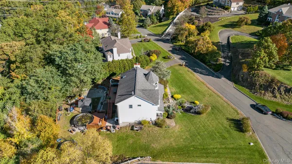 an aerial view of residential house with swimming pool