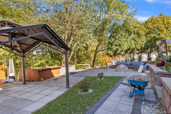 a view of a patio with swimming pool table and chairs