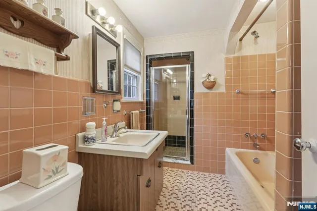 a living room with furniture window and wooden floor