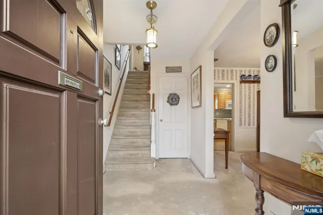 a living room with furniture a rug and a fireplace