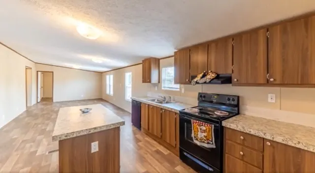 a view of kitchen with wooden floor