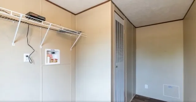 a kitchen with granite countertop a stove sink and cabinets