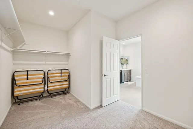 a view of a room with stairs and a bathroom