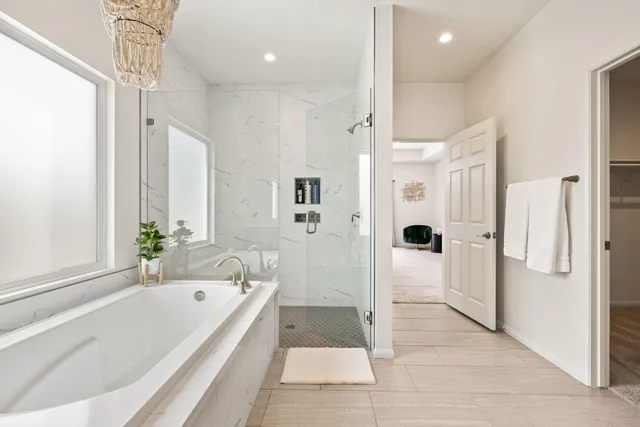 a bathroom with a bathtub and a shower