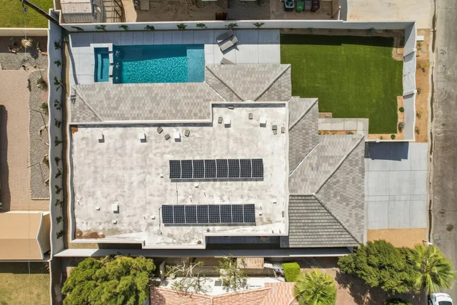 a aerial view of a house with swimming pool