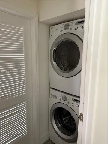 a view of a hallway with washer and dryer